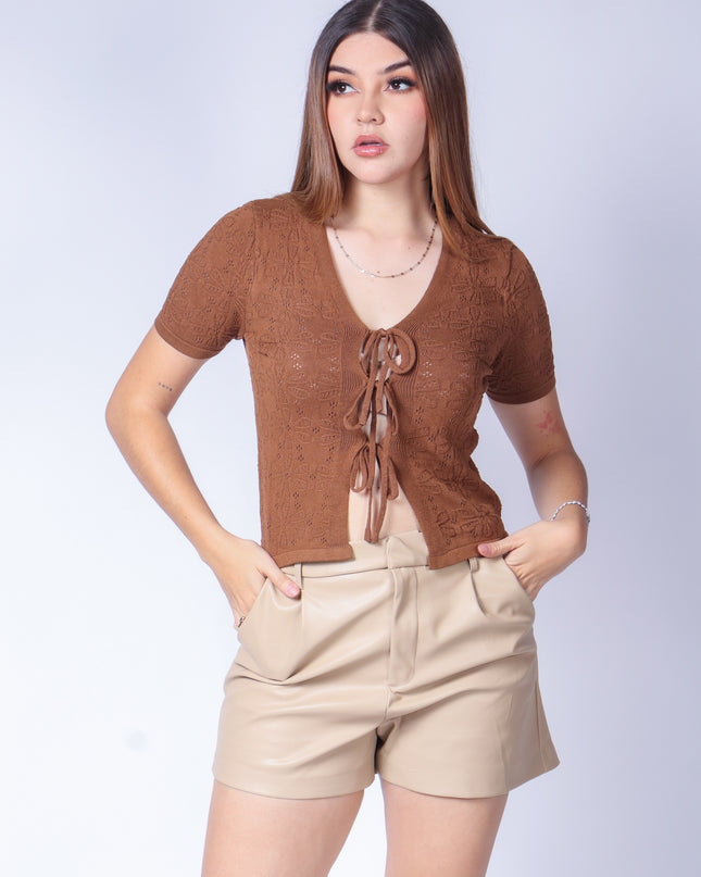 Blusa de punto con moños.