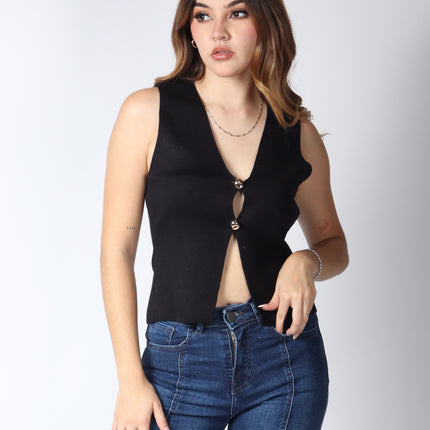 Blusa punto botón dorado.