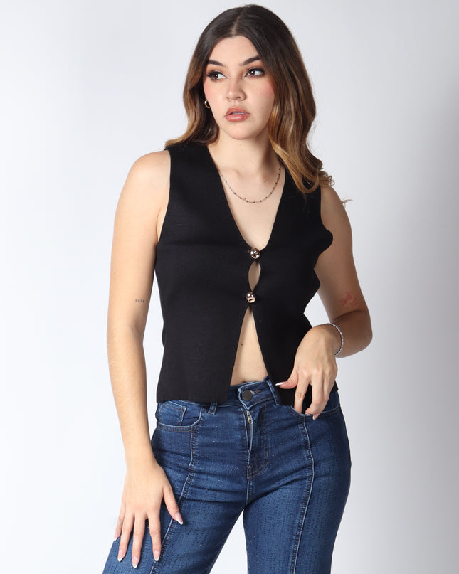 Blusa punto botón dorado.